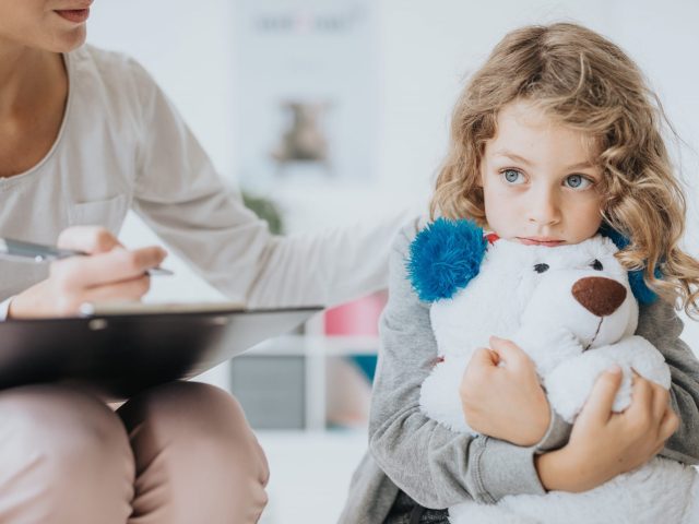 Kobi_Sad boy with teddy bear